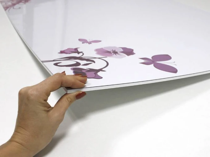 Magnetic whiteboard with floral design in shades of purple and butterflies on a white background.