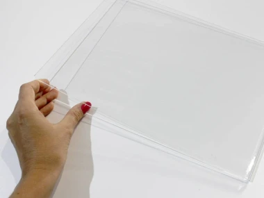 A4 plexiglass shirt - Graphic design. Transparent, rectangular shape with smooth edges.