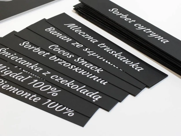 Chalkboard magnet with custom print - Graphic design. Black background with white text in various styles.