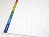 Magnetic dry-erase weekly planner board - Simple grid design with days of the week in various colors.