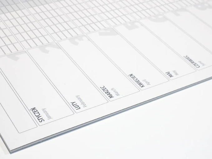 Magnetic dry-erase calendar board, universal yearly design with a simple grid of month and day names.