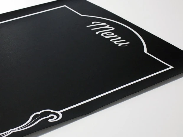 Chalkboard menu sign 013 - Simple black surface with white "Menu" text and decorative design.