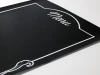 Chalkboard menu sign 013 - Simple black surface with white "Menu" text and decorative design.
