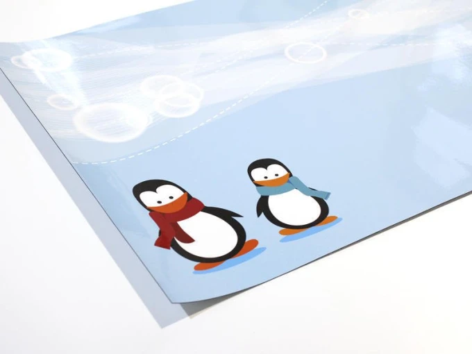 Magnetic dry-erase board for kids featuring penguins on a blue background with two penguin designs.