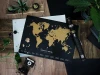 Scratch-off world map Loft Black - Modern interior decor with gray and black walls.