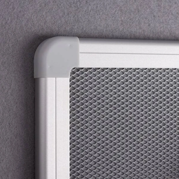 Magnetic pinboard - Graphic design with a visible metal grid in a silver frame and plastic corners.
