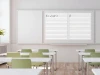 Magnetic dry-erase overlay with a fine 1cm grid - Classroom setup with light walls and wooden flooring.