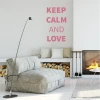 Wall template Keep calm and love 1947 - Living room arrangement. Light walls, minimalist furniture, fireplace.