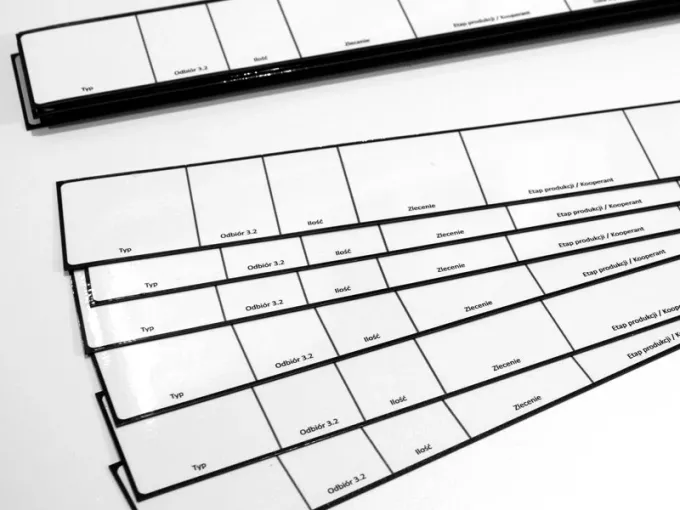 Custom dry-erase magnet with graphic design. Simple white rectangles with black borders.