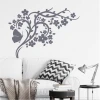Butterfly branch painting stencil 2121 - Living room decor with light walls and plant elements.