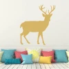 Deer painting stencil 2135 - Living room decor with light-colored walls and cushions in various shapes and colors.