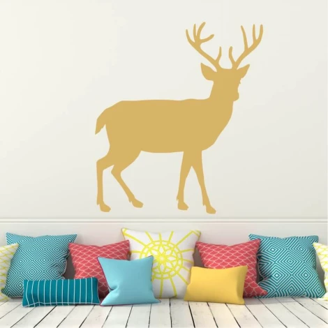 Deer painting stencil 2135 - Living room decor with light-colored walls and cushions in various shapes and colors.