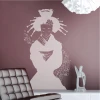 Painting template of a woman silhouette 2058 - Living room setup with brown walls and modern furniture.