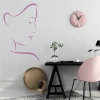 Face painting template 2029 - Office setup with light walls, minimalist furniture, and a flower-shaped clock.