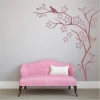 Wall template tree bird 2115 - Living room decor. Light-colored walls, pink sofa.