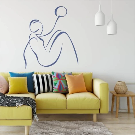 Wall template of a woman with a ball 2036 - Living room setup. Light walls, colorful cushions on the sofa.