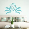 Flower wall template 2053 - Living room arrangement. Light walls, sofa with geometric patterned cushions.