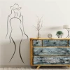 Woman silhouette wall template 2037 - Living room decor with light walls and rustic wooden furniture.