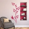 Butterfly branch wall template 2092 - Living room arrangement with light walls and dark furniture.