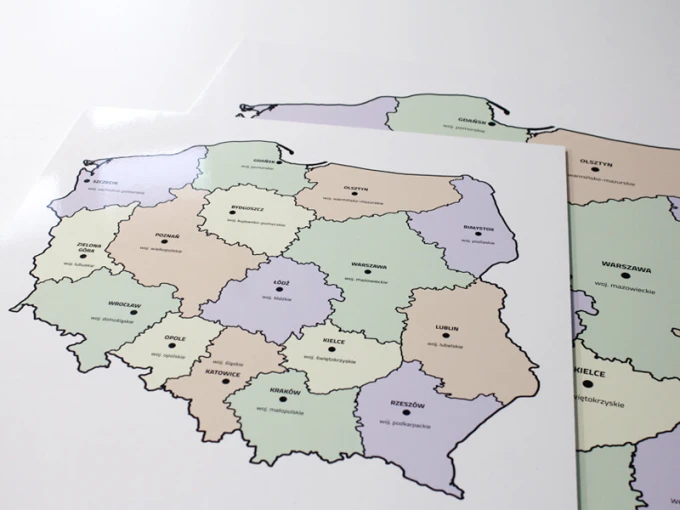 Polish dry-erase board with a map divided into voivodeships, featuring a graphic design.