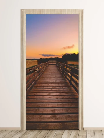 Door mural FP 6210 - Hallway decor. A wooden bridge leads towards the setting sun.