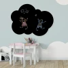 Chalkboard magnetic cloud board for kids - styled in a bright children\'s room with light walls and flooring.