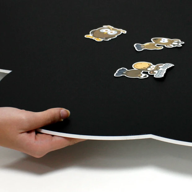 Magnetic chalkboard for kids, cloud shape with colorful figures on a black background.