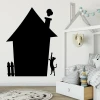 Magnetic board for kids, chalkboard house design with a black outline, cat reaching for the chimney.