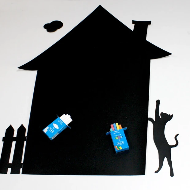 Magnetic board for kids, chalkboard house design with a black chimney, cat, and fence.