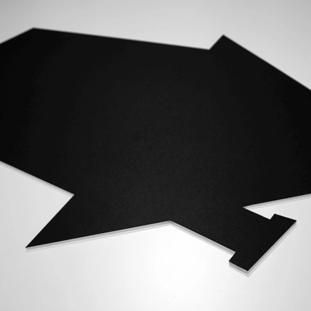 Magnetic chalkboard for kids in the shape of a house with a cat cutout. Black design for creative play.