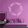 Wall sticker 2338 with "I love you" - Bedroom decor. Purple wall, bed with pillows.