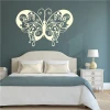 Butterfly wall sticker 2350 - Bedroom decor with dark walls and a bed featuring light bedding.