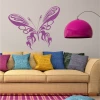 Wall sticker fiery butterfly 2346 - Living room decor. Light-colored walls, sofa with colorful cushions.