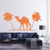 Palm wall sticker 2341 - Living room decor with light-colored walls and blue furniture.