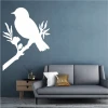 Wall sticker of a bird on a branch 2372 - Living room decor. Gray walls and light furniture.