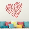 Heart wall sticker 2340 - Living room decor with light-colored walls and a sofa with colorful cushions.