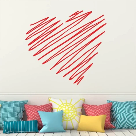 Heart wall sticker 2340 - Living room decor with light-colored walls and a sofa with colorful cushions.