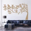 Wall sticker of a rustling tree 2383 - Living room decor with light walls, dark sofa, and table.