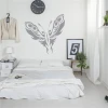 Patterned butterfly wall sticker 2357 - Bedroom decor with light walls, minimalist furniture, and greenery.