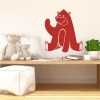 Children\'s wall sticker bear 2271 - Graphic design. Red smiling bear sitting with raised paw.