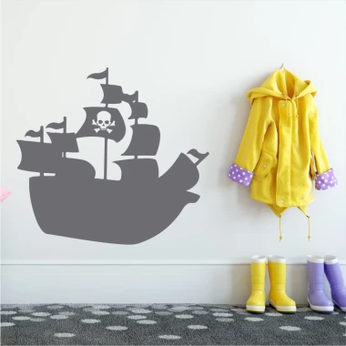 Pirate ship wall sticker for kids 2277 - Decor in a child\'s room with a light-colored wall and a yellow jacket nearby.