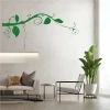 Wall sticker branch 2374 - Living room arrangement. Light-colored walls, neutral-toned furniture.