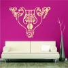 Wall sticker 2248 - Living room setup with a fuchsia wall, light sofa, and modern plant.