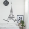 Eiffel Tower wall sticker 2293 - Bedroom decor with light-colored walls, minimalist furniture, and a clock.