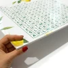 Custom dry-erase board with green lemon graphics, perfect for creative spaces in modern interiors.