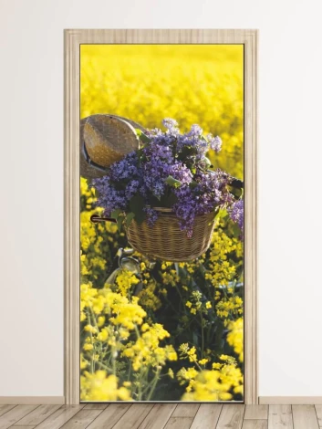 Door mural featuring a bicycle among flowers, with a basket full of blooms on a yellow background.