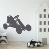 Go-kart wall sticker 2324 - Decor for a child\'s room with light-colored walls and minimalist furniture.