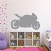 Motorcycle wall sticker 2310 - Decor for a child\'s room with light-colored walls and colorful dots.
