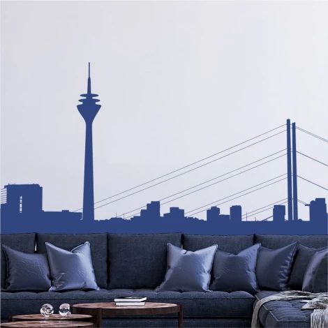 City skyline wall sticker 2282 - Living room setup with light-colored walls and a dark sofa with cushions.