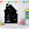 Chalkboard for kids in a house design, featuring light-colored walls and a carpeted floor in a children\'s room.